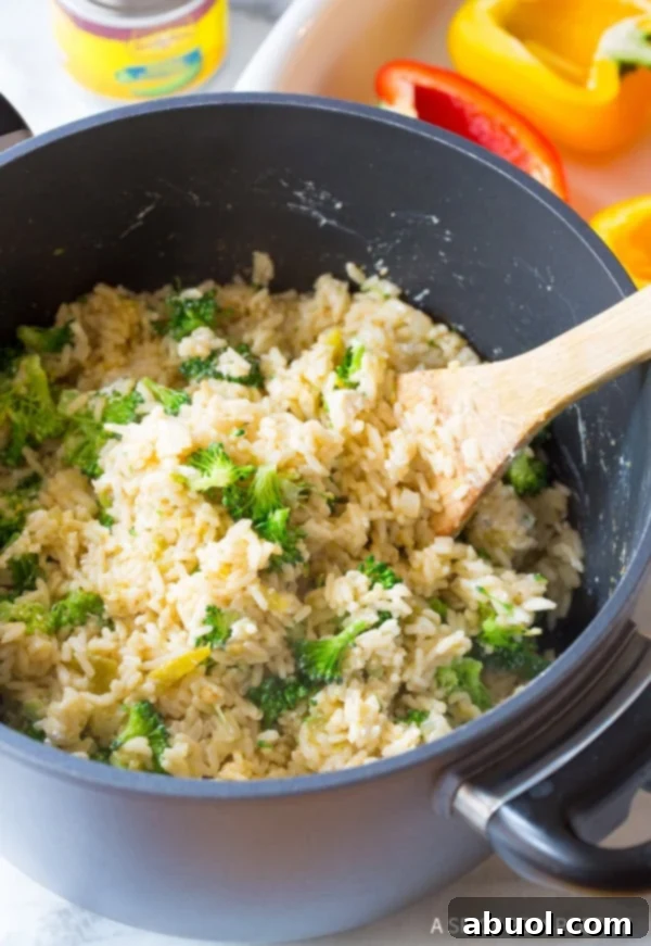 Pot filled with cooked rice and broccoli. 