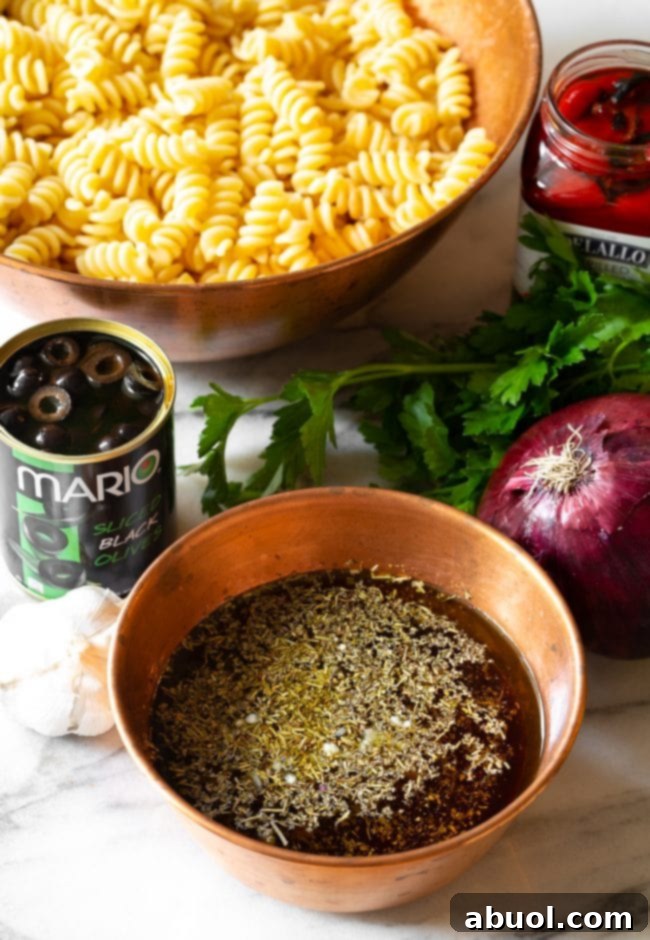 Close-up shot of homemade Italian vinaigrette in a small bowl with a whisk, surrounded by fresh garlic cloves and olive oil, key ingredients for the zesty dressing.