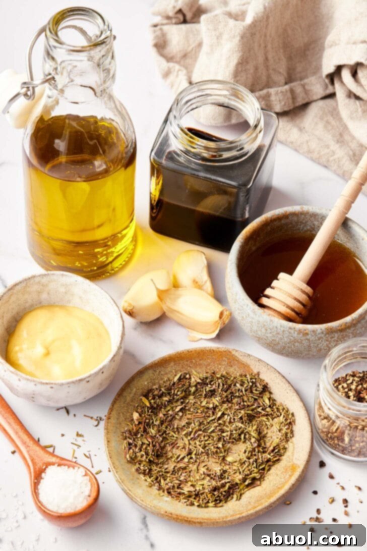 Ingredients needed for balsamic dressing recipe on counter.