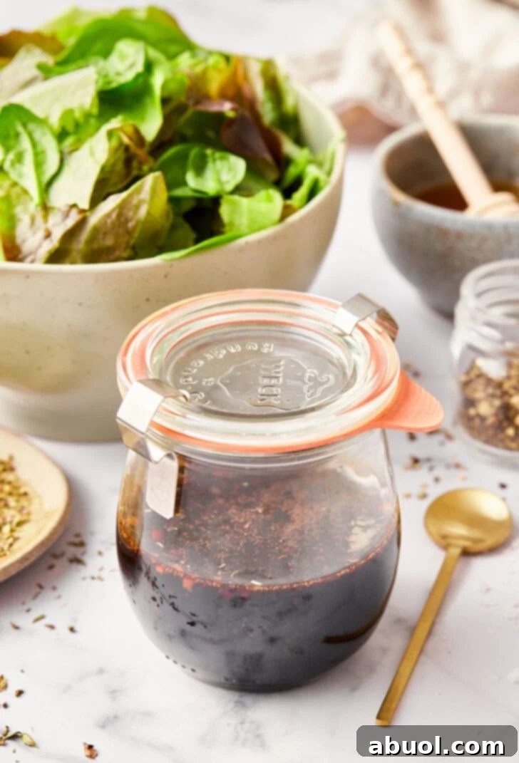 how to make balsamic dressing - close up of ingredients in jar