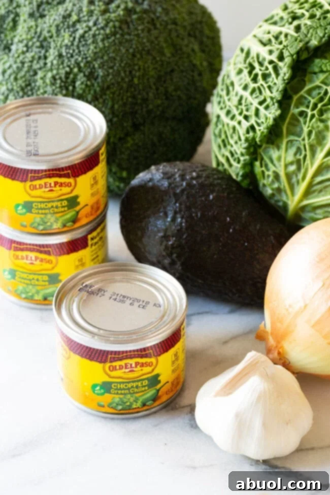 Essential Ingredients for Healthy Detox Soup A vibrant selection of fresh ingredients for Southwest chicken detox soup laid out on a wooden cutting board.