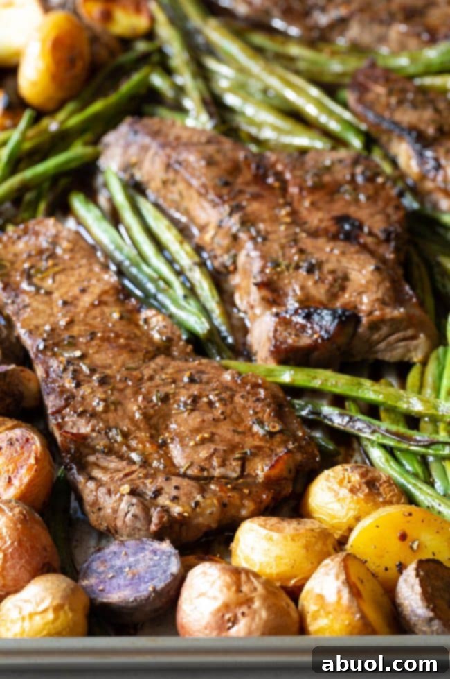 Close up view of this baked steak and the veggies with it