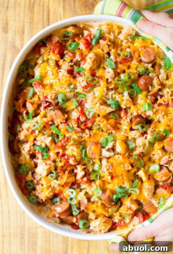 Overhead shot of cajun chicken and rice casserole in a white baking dish. 