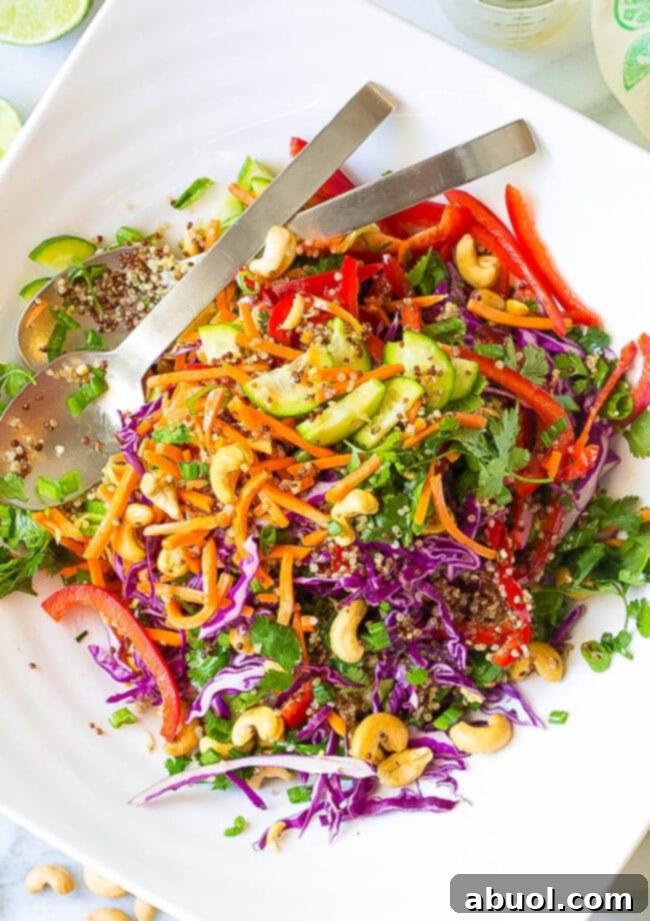 Best Quinoa Salad Recipe with homemade Thai dressing, tossed in a large bowl