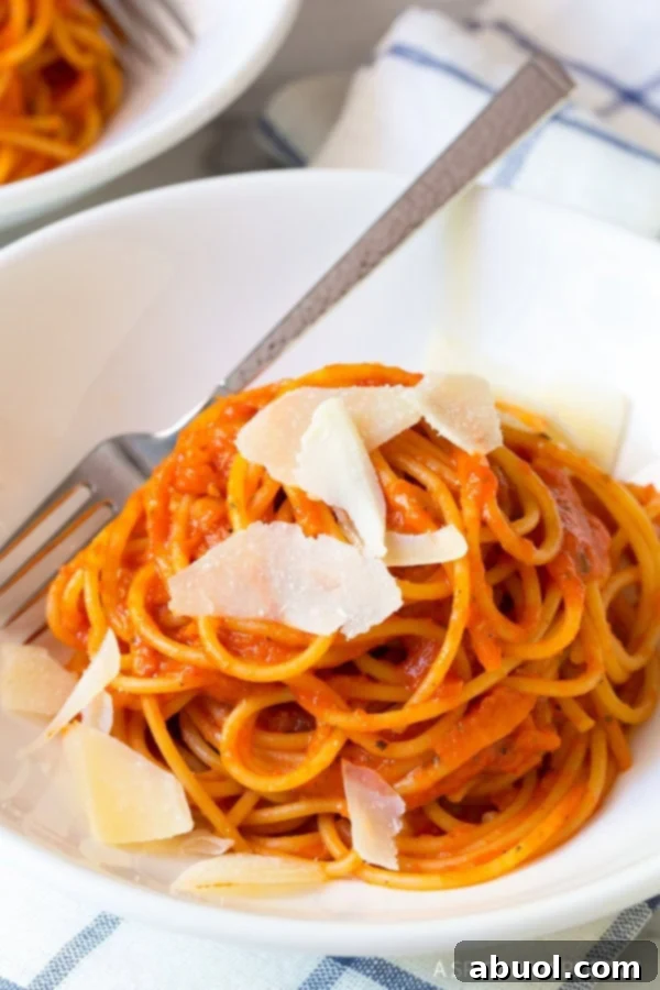 Roasted red pepper pasta with shaved parmesan on top. 