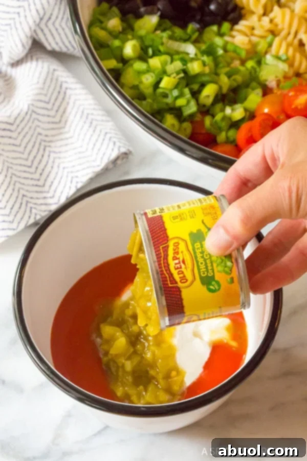 Mixing the Zesty Dressing for Chicken Taco Pasta Salad
