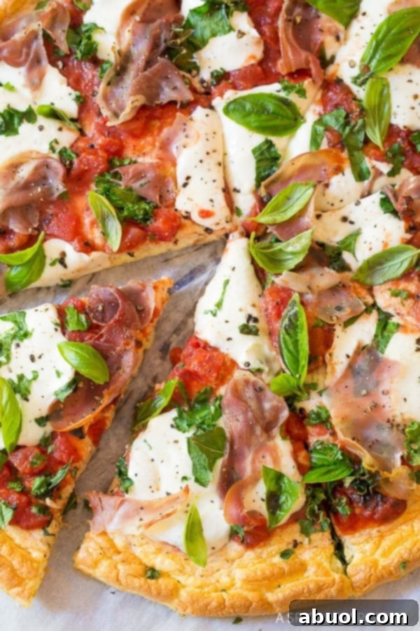Individual slices of cloud bread pizza, showcasing the light crust and rich toppings, ready to be enjoyed.