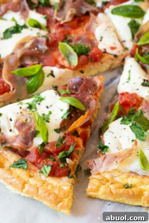Low carb cloud bread pizza, beautifully sliced into individual portions, ready for serving.