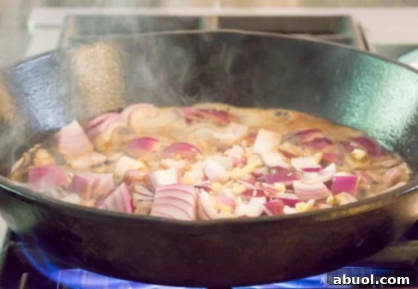 Croatian Chicken and Peppers - onions sauteing in pan