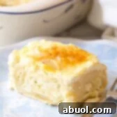 A perfectly baked, golden-brown Croatian Cheese Strukli, presented as a comforting and inviting dish.