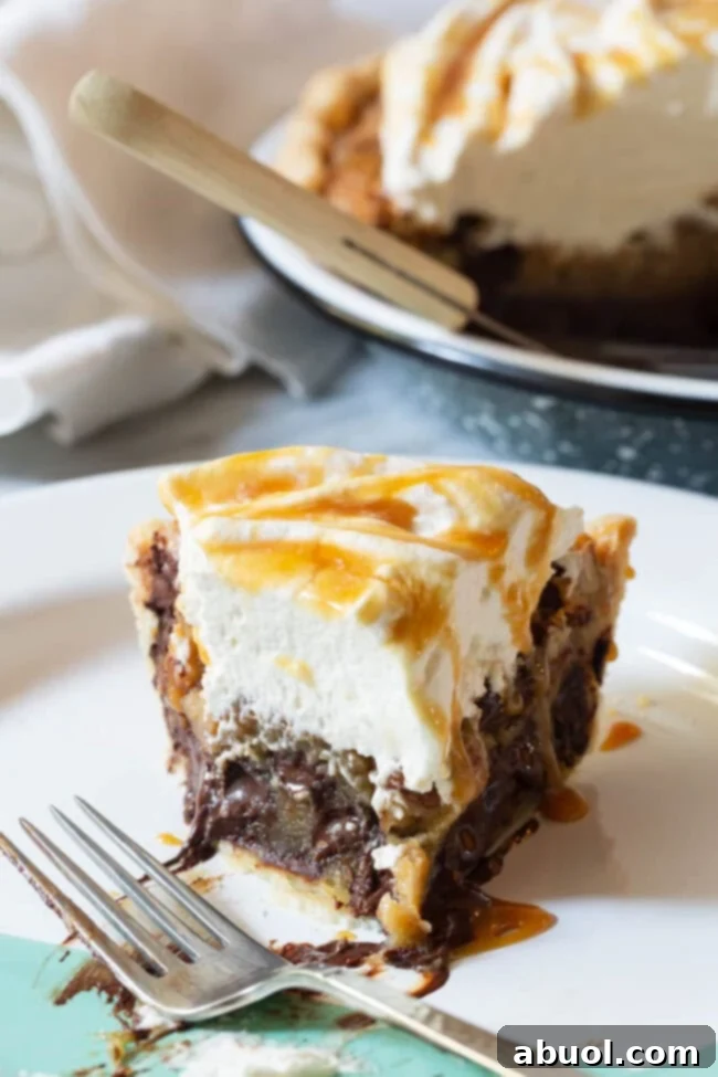 A beautifully presented Kentucky Derby Pie, infused with bourbon and ready to be served, making a perfect holiday or Derby Day dessert.
