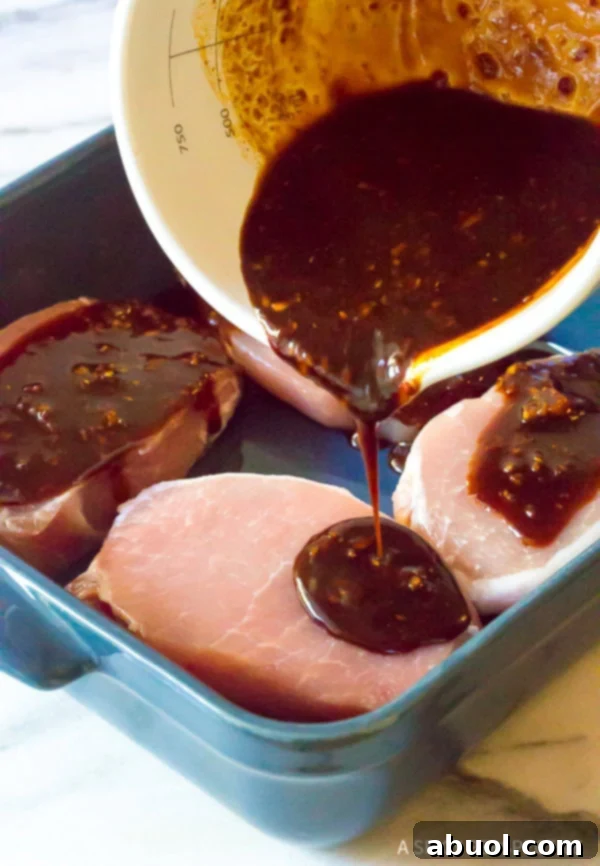 Making Korean Pork Chops - pouring marinade over the hot