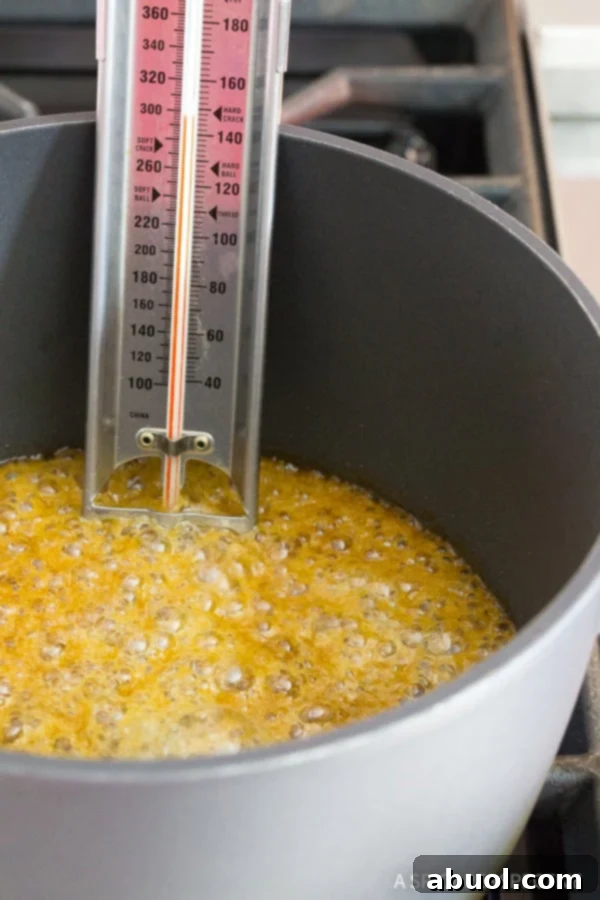 Chocolate Toffee #ASpicyPerspective Toffee boiling in pot with candy thermometer