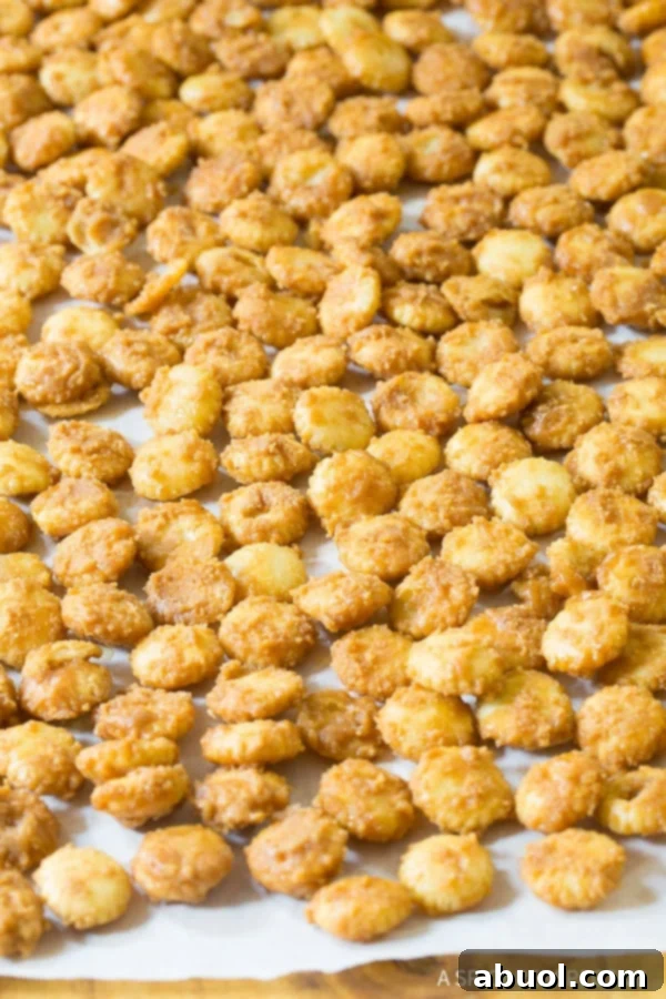 Chocolate Toffee #ASpicyPerspective Oyster crackers coated in toffee drying on cookie sheet