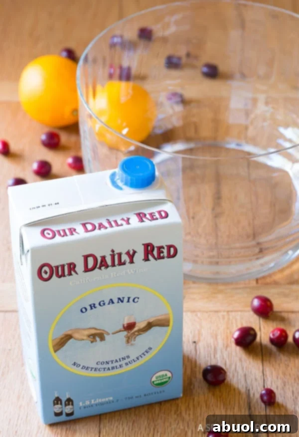 Making large batch cocktails - Boxed red wine next to an empty punch bowl.
