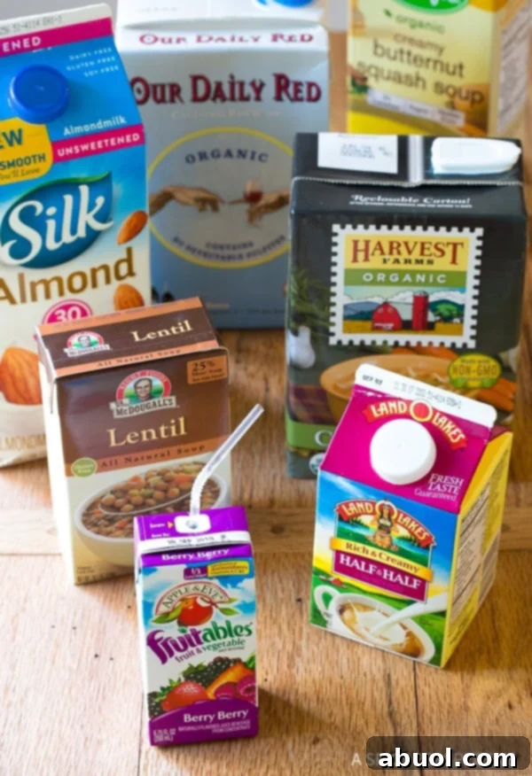 Cartons of food and drinks on a wooden background.
