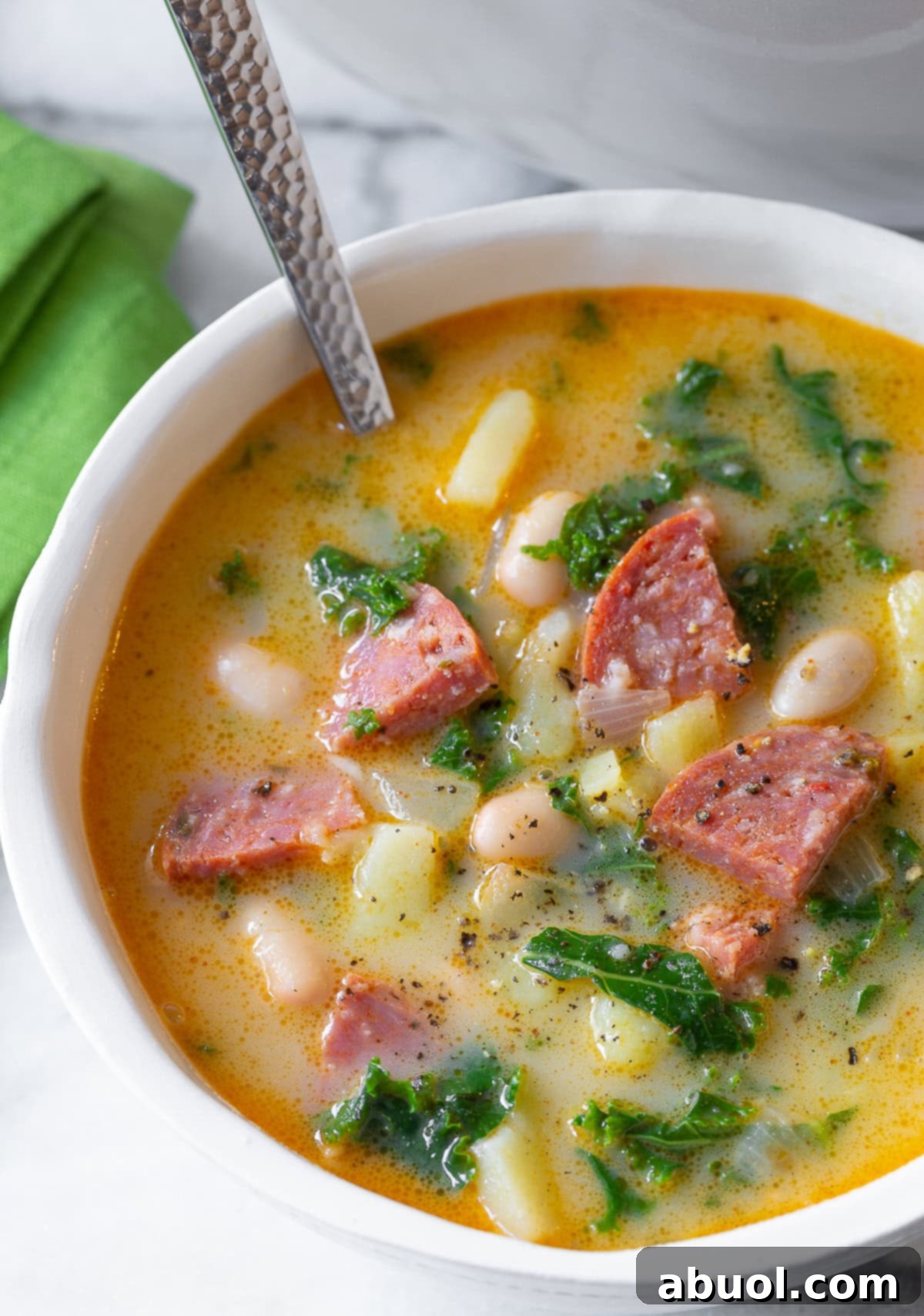 caldo verde - Portuguese soup recipe in bowl with spoon