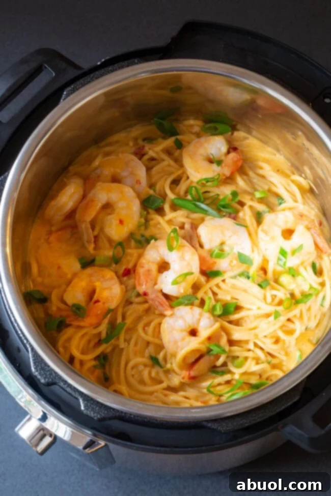 Close-up of perfectly cooked Instant Pot Bang Bang Shrimp Pasta, ready to serve