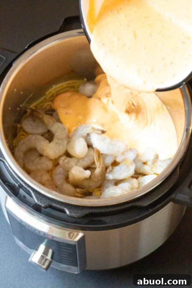 Garnished Instant Pot Bang Bang Shrimp Pasta ready to eat