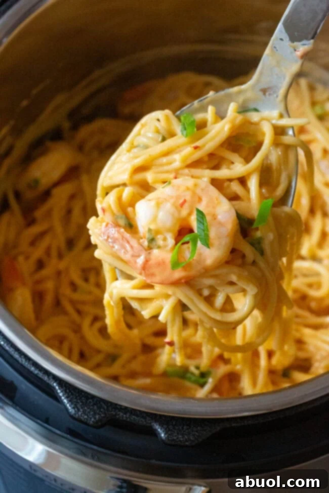Warm and steamy Instant Pot Bang Bang Shrimp Pasta, close up