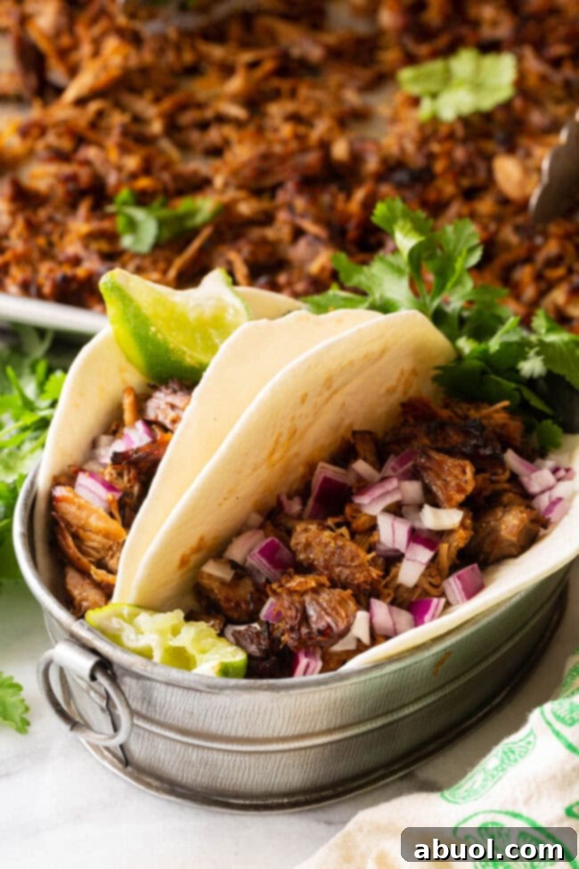 Crispy Instant Pot Carnitas 13 A vibrant platter of Instant Pot Carnitas, ready to be served with your favorite toppings and tortillas.