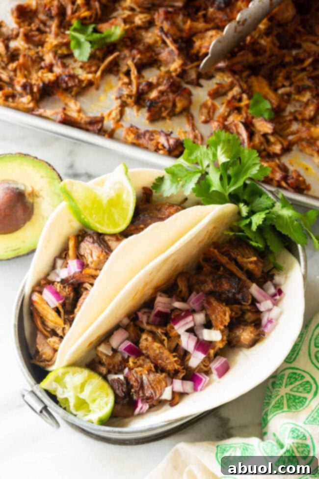 Crispy Instant Pot Carnitas 5 Zesty Instant Pot Carnitas beautifully wrapped in warm tortillas, ready to be enjoyed as flavorful pork tacos with fresh lime and cilantro