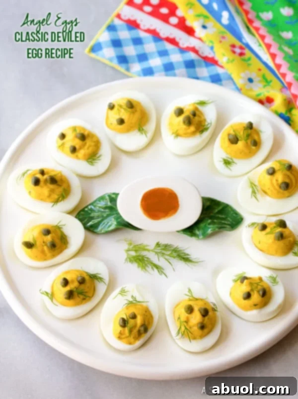 Best Deviled Eggs Recipe resting on a deviled egg plate, garnished with fresh herbs.