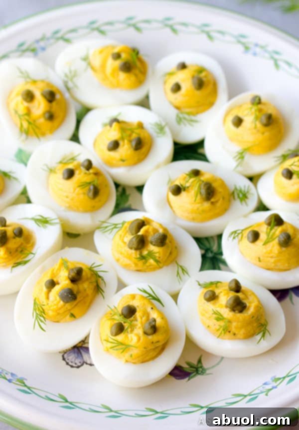 Angel Eggs Recipe with capers and fresh dill garnish.