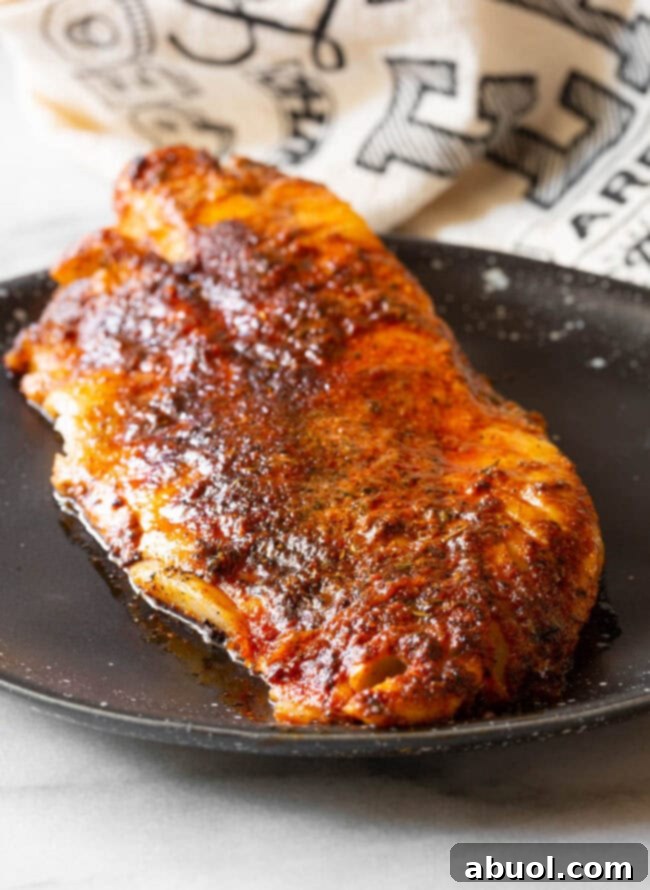 Close-up shot of the vibrant, finely ground blend of spices for blackened seasoning.
