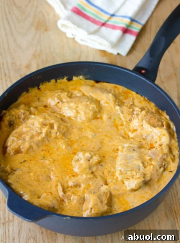 Hungarian Paprikash with thick sour cream paprika sauce in skillet.