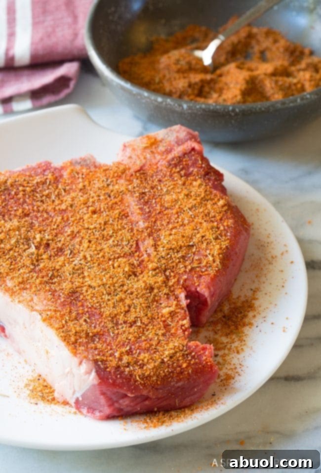 How to make The Best Homemade Steak Seasoning Recipe (Simple Steak Rub!) - The seasoned steak resting before cooking.