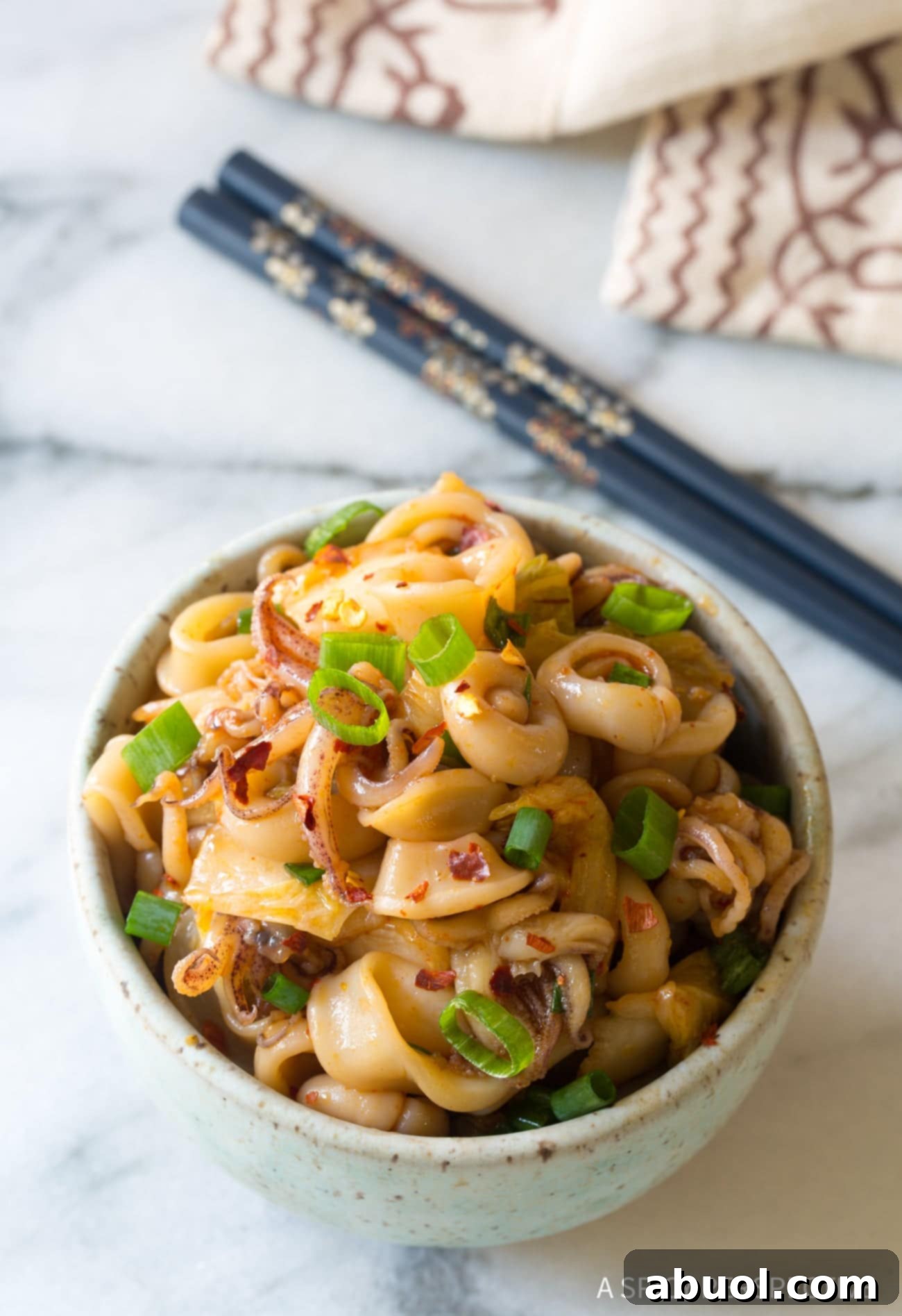 Tako Poke (Octopus or Squid) overhead shot in bowl with scallions on top