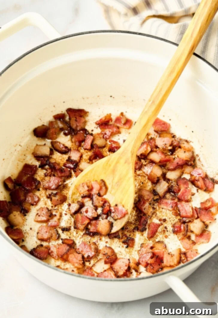 Heavenly Bacon Corn Muffins 6 Bacon cooking in a pan, crisping up before being added to the muffin batter.