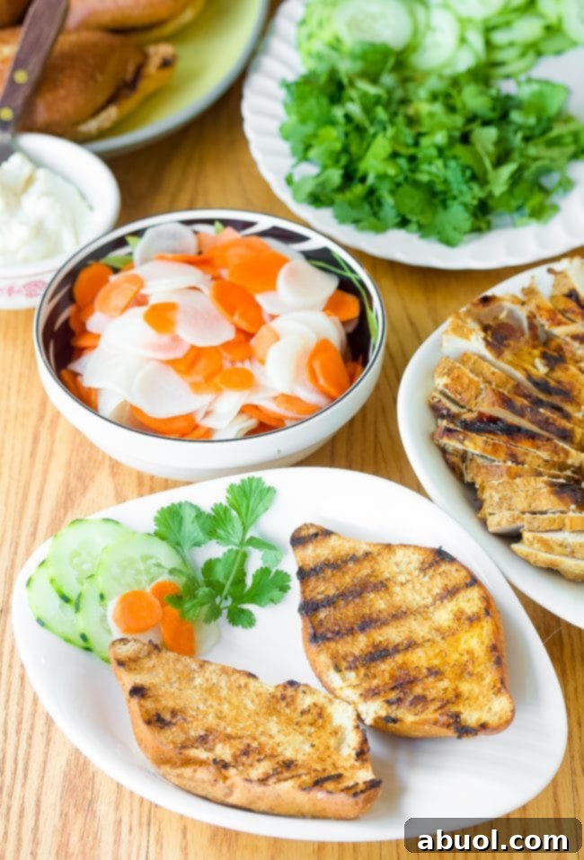 Banh Mi sandwich recipe with grilled bread halves on plates, ready for toppings