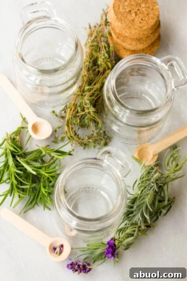 Several empty glass jars are artfully arranged, surrounded by an assortment of fresh, aromatic herbs like rosemary, thyme, and lavender, hinting at the potential for flavorful honey infusions.