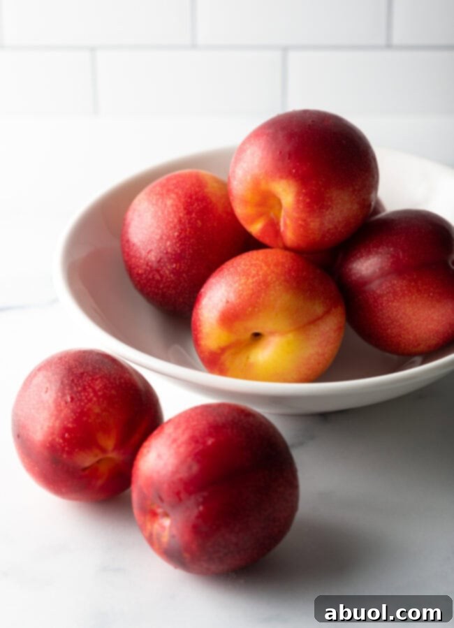 Fresh, ripe plums ready for baking, showcasing their vibrant color.