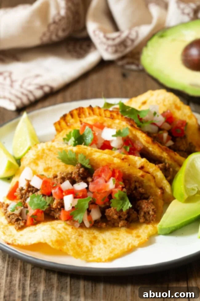 A close-up view of loaded low-carb cauliflower tacos on a plate, highlighting the delicious fillings and sturdy shells.