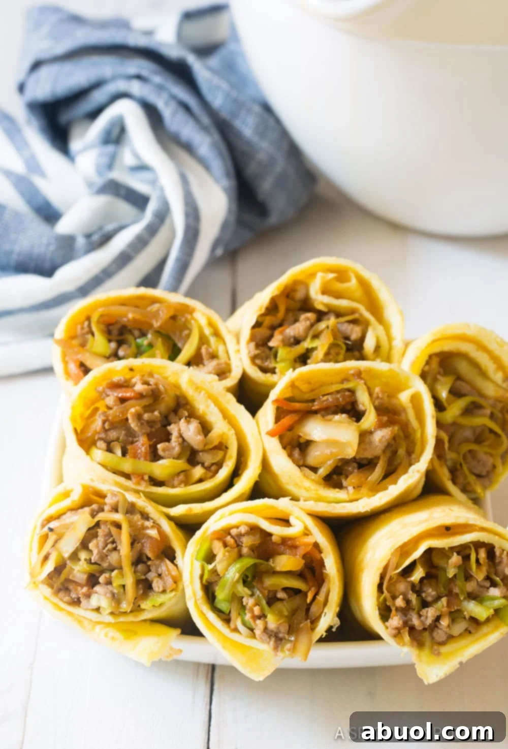 Keto Eggrolls - sliced in half and neatly stacked on a plate