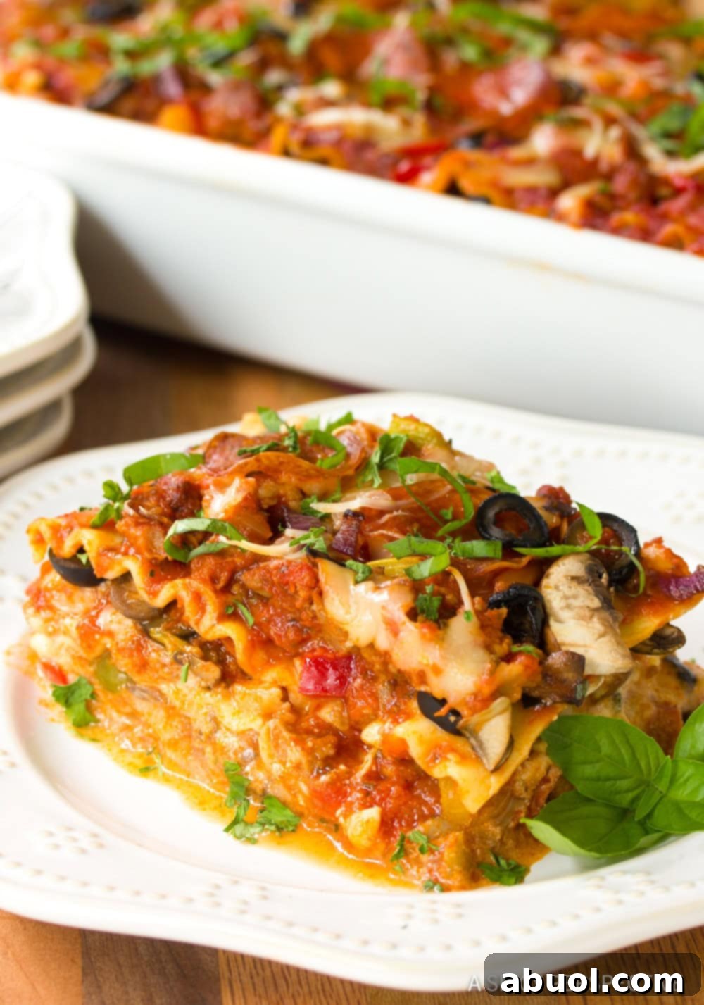 Epic Pizza Lasagna Fusion 9 A tantalizing close-up of a slice of Pizza Lasagna, highlighting the melted cheese and layers.
