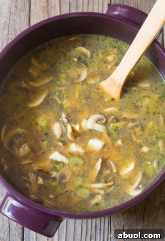 A chef's perspective on preparing creamy chicken mushroom soup, showcasing fresh ingredients.