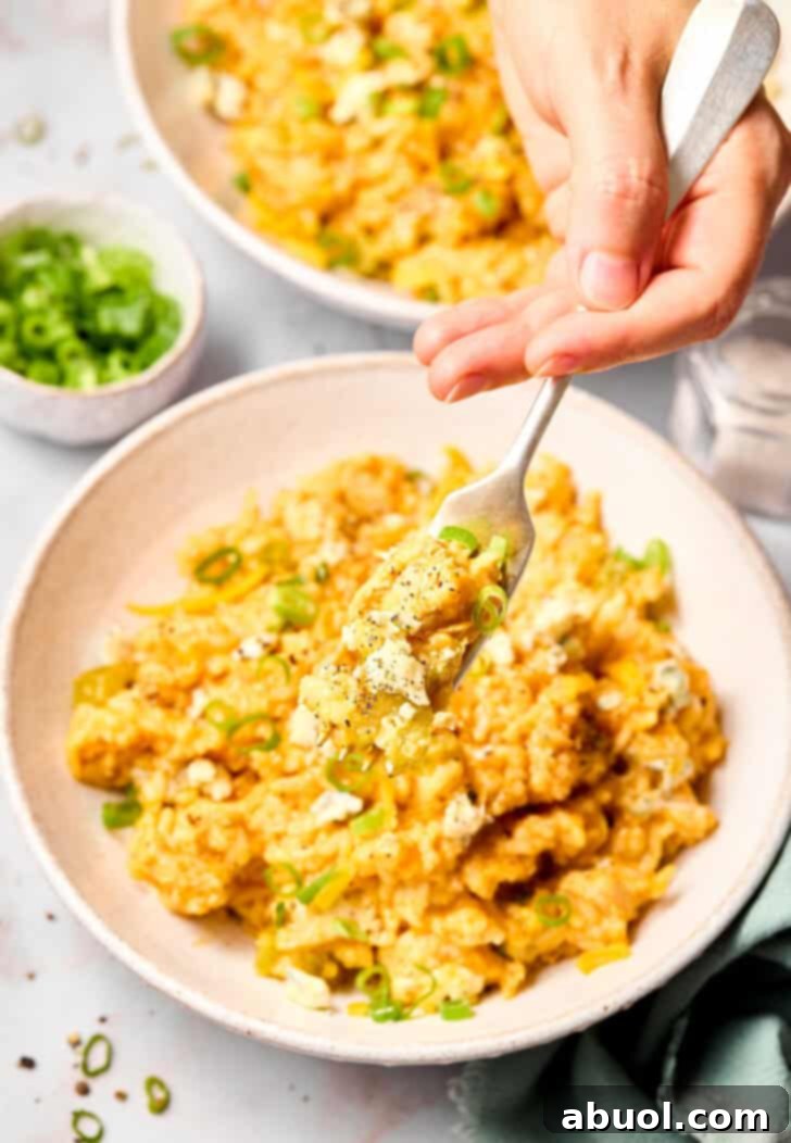 fork lifting chicken and rice 