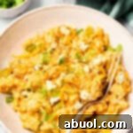 Buffalo Chicken Casserole Recipe with rice on bowls with fork