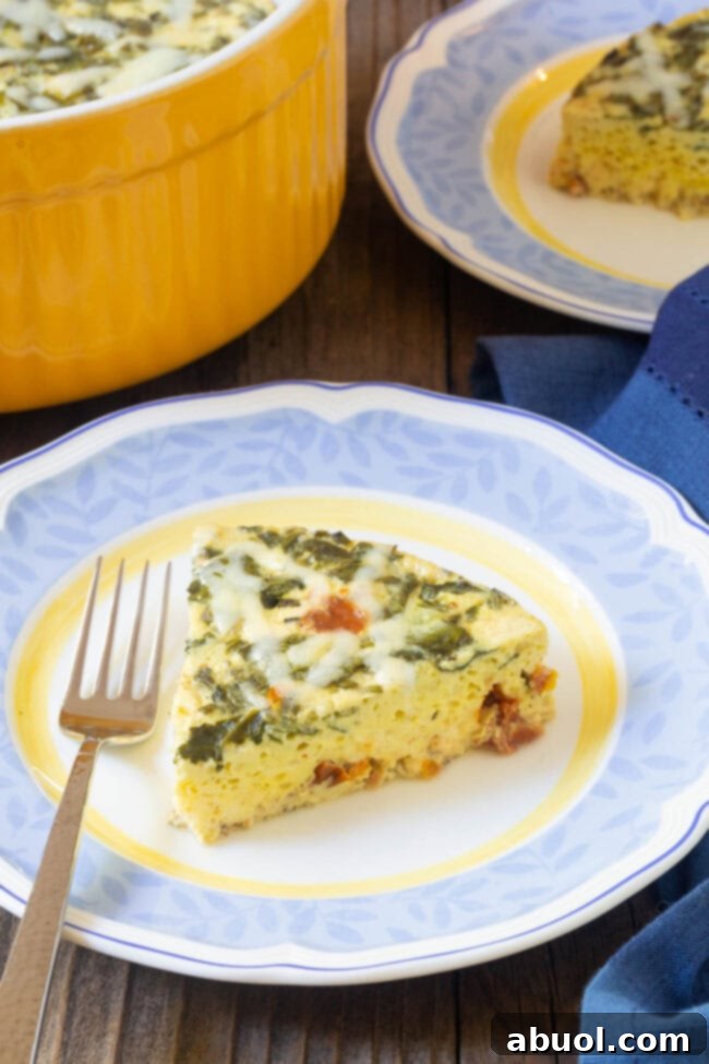 A close-up shot of a fluffy, golden slice of Instant Pot Keto Crustless Quiche on a white plate, highlighting its rich ingredients and perfect texture.