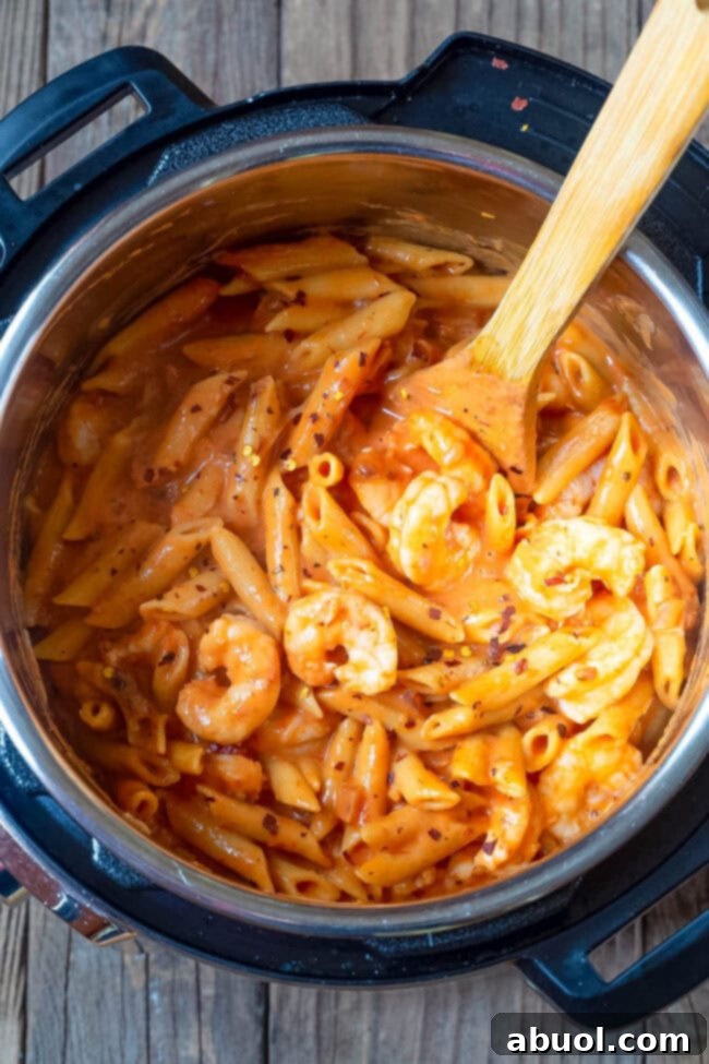 Overhead shot of shrimp pasta with vodka sauce in an instant pot.