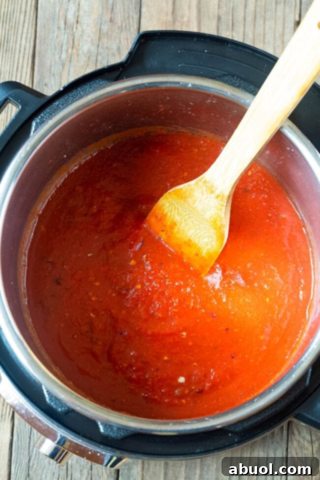 Tomato sauce cooking in an instant pot.