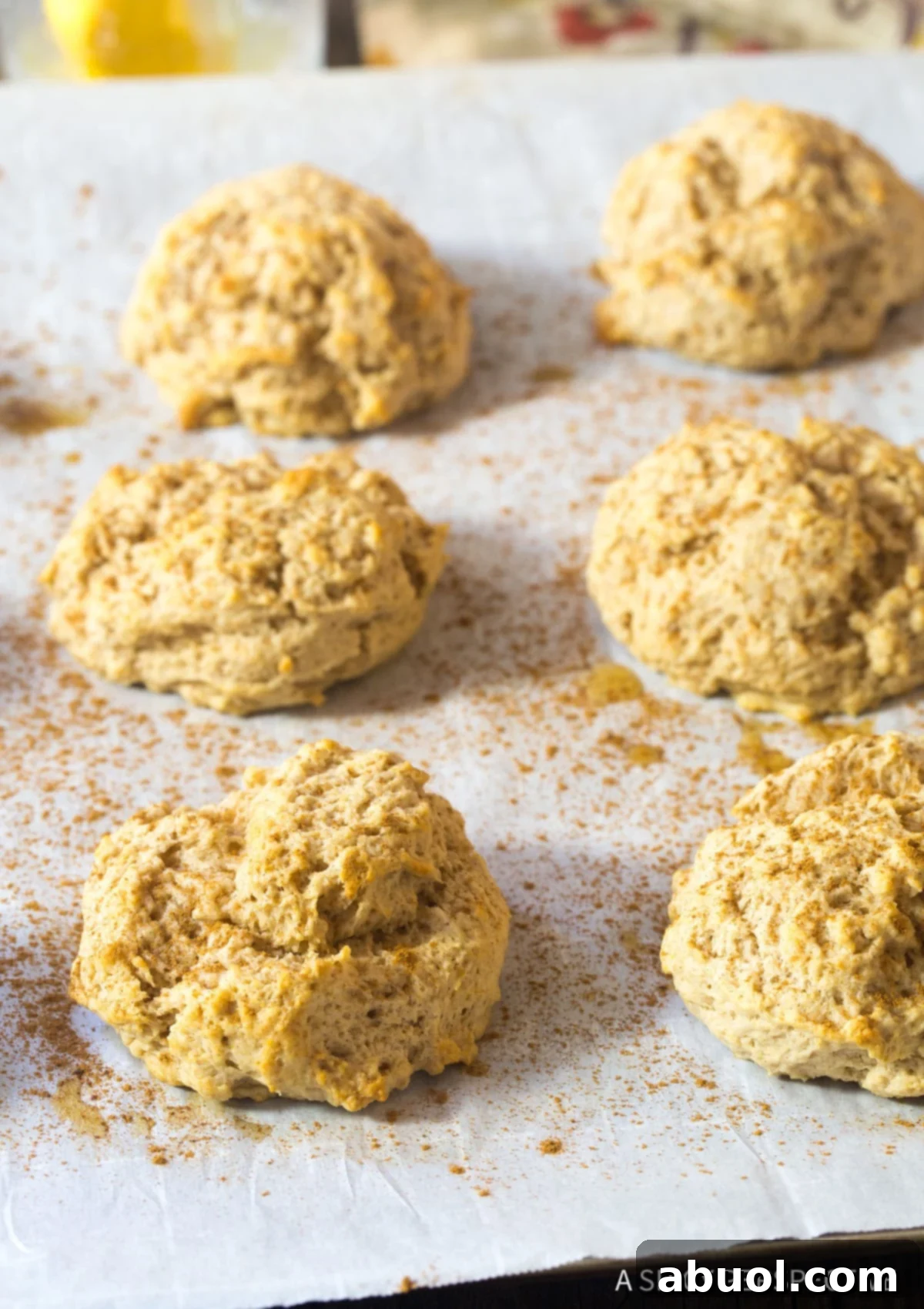 Freshly baked Cinnamon Biscuits cooling on a wire rack, steam gently rising, straight out of the oven