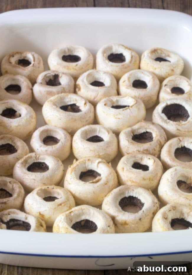 Creamy Dreamy Mushrooms 3 Making the Best Cheese Stuffed Mushrooms - empty mushroom caps in baking dish