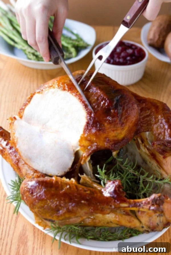 Hands expertly carving into a whole roasted turkey, revealing juicy, tender meat, highlighting the success of a well-brined bird.