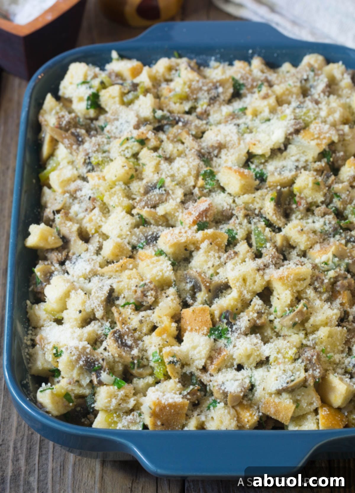 Savory Sausage & Wild Mushroom Stuffing 7 Unbaked thanksgiving stuffing with mushrooms and sausage - cheese on top