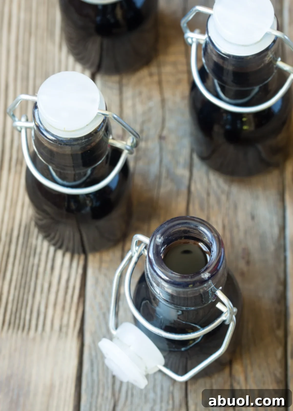 Trendy Homemade Bourbon Vanilla Extract in small bottles. 